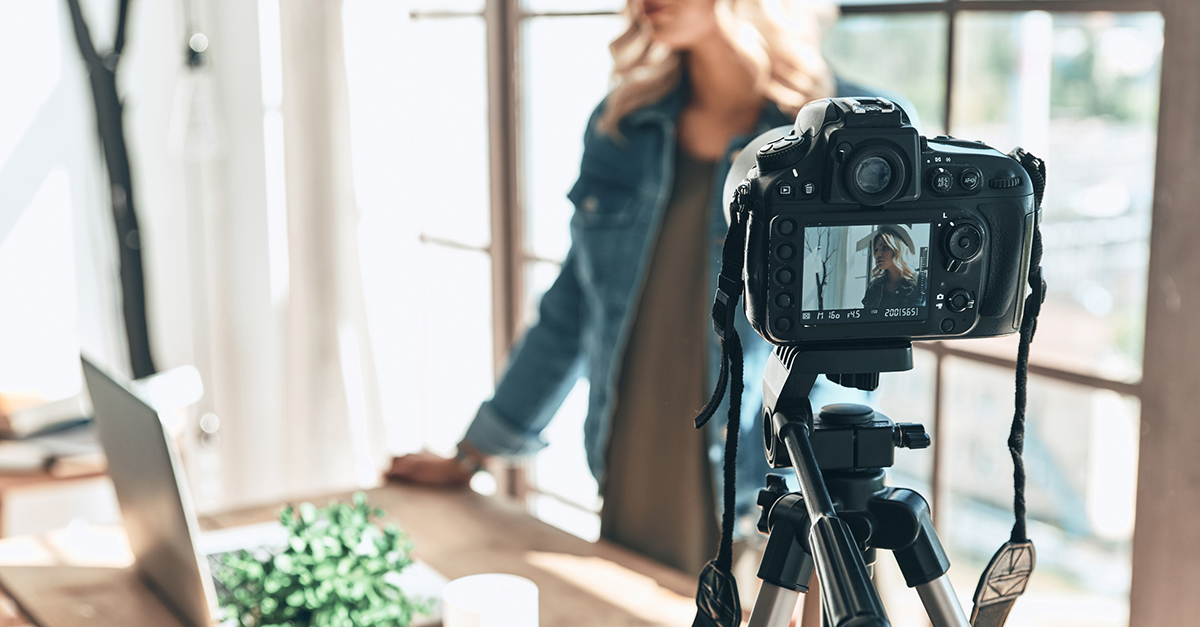 A woman films a YouTube video